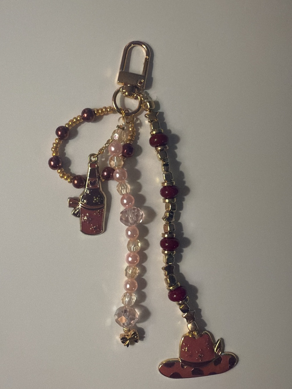 Beaded Pink and Gold Charm Keychain with Hat & Bottle Charms
